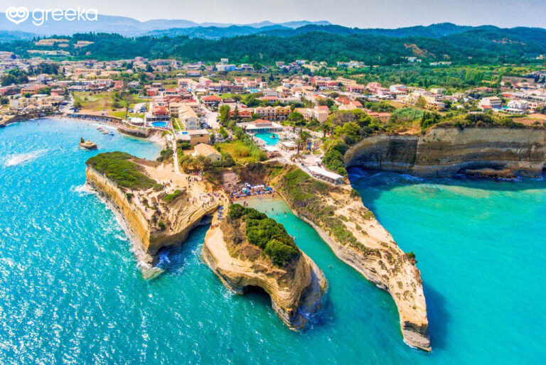 The coast of Sidari showcases the iconic Canal d’Amour, a unique geological formation with crystal-clear, shallow waters ideal for swimming and snorkeling